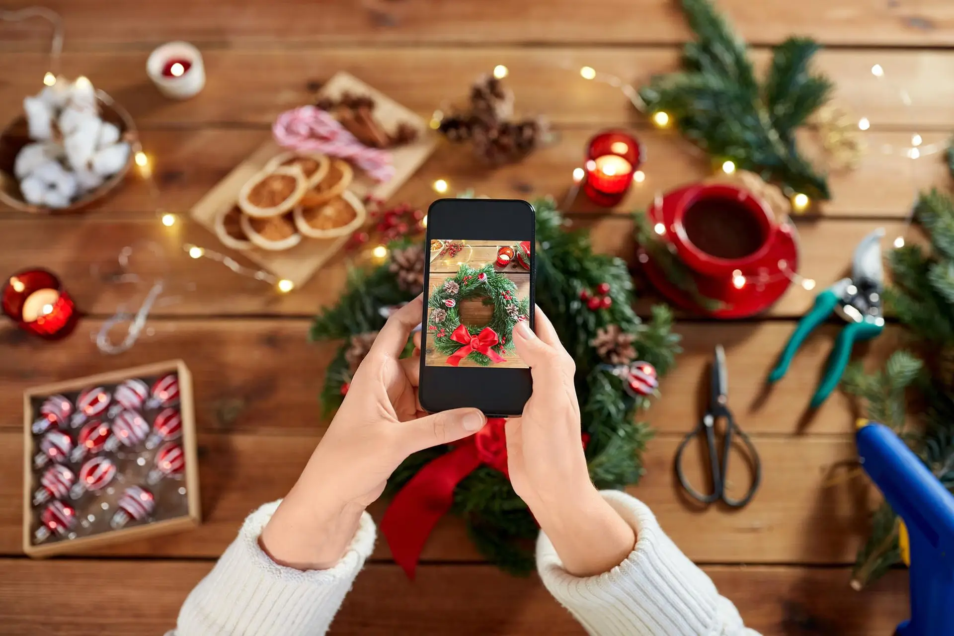 Person taking a photo of Christmas crafts