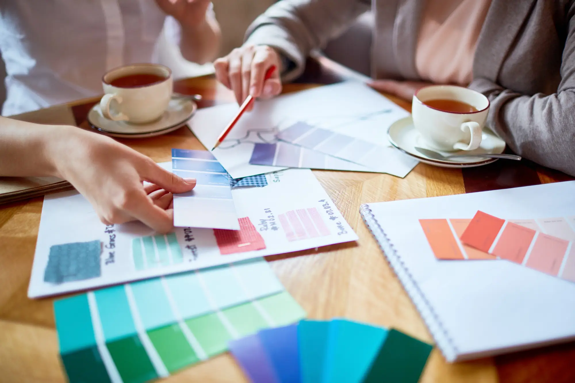 A meeting with different colour swatches on a table