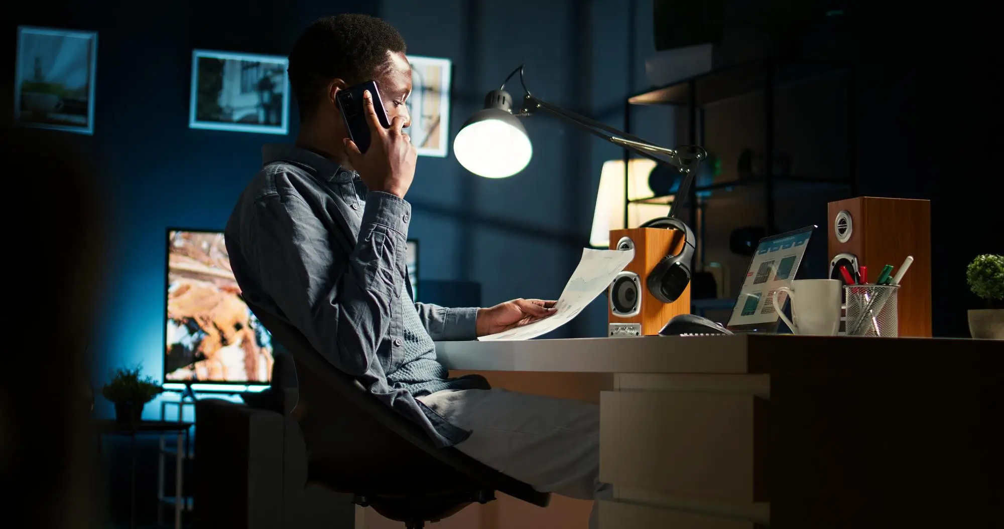 A worker on the phone making a sale late at night