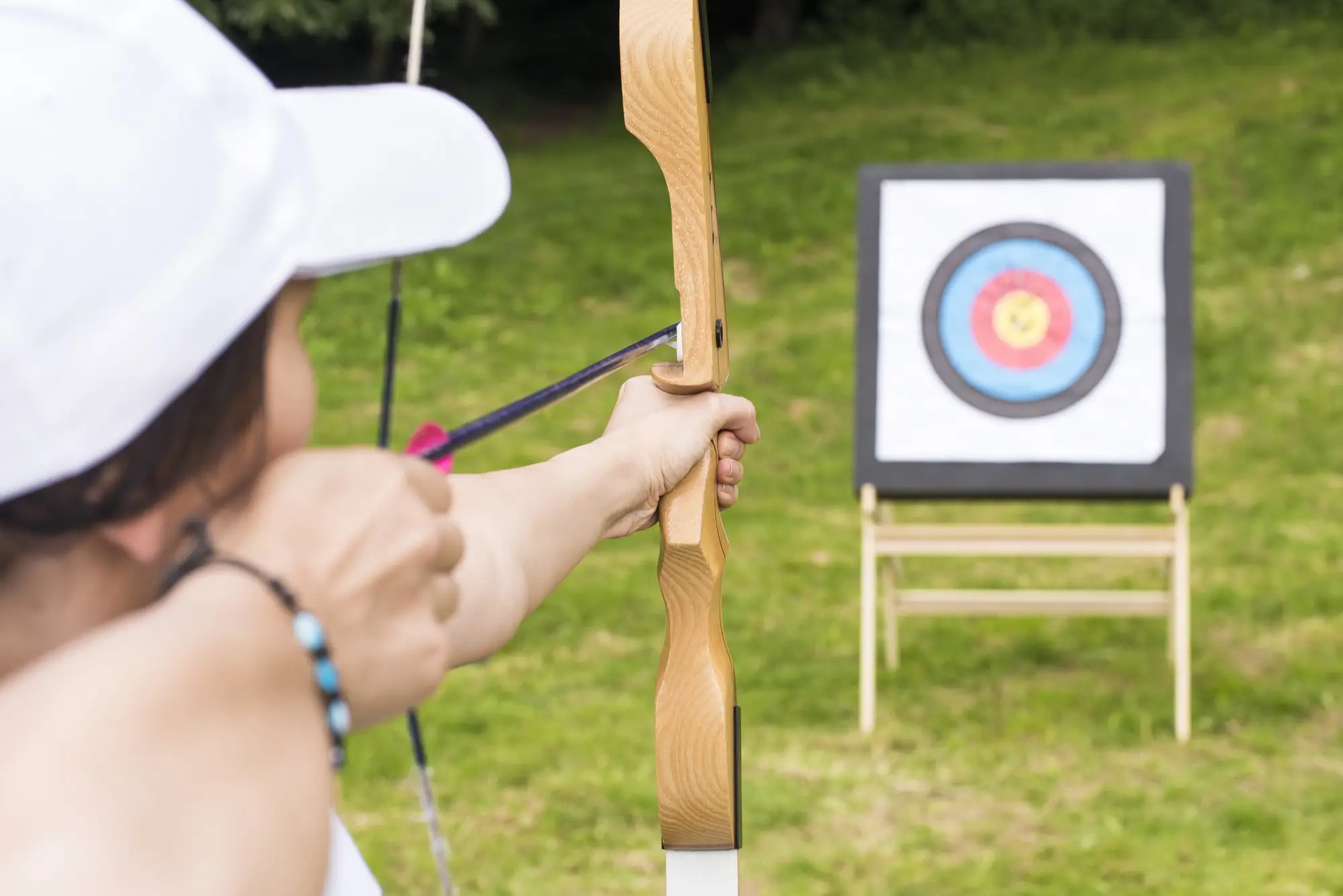 Female archer about to fire at a nearby target